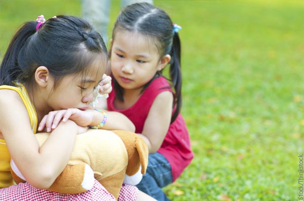 Girl comforting sister