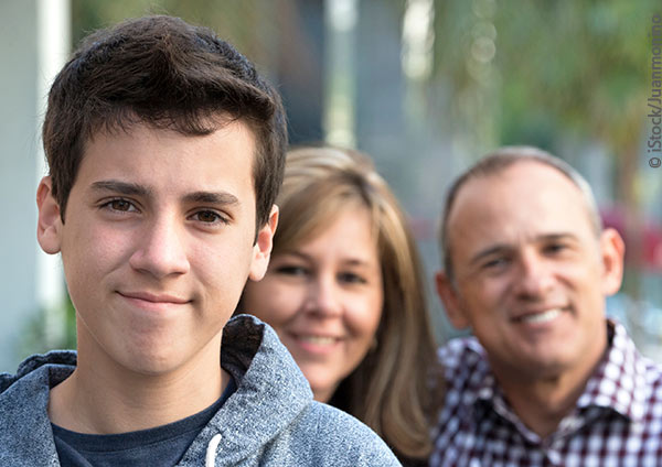 teen boy with parents