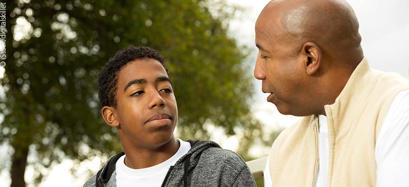 Dad talking to son