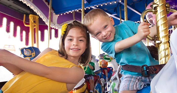 boy and girl on carousel