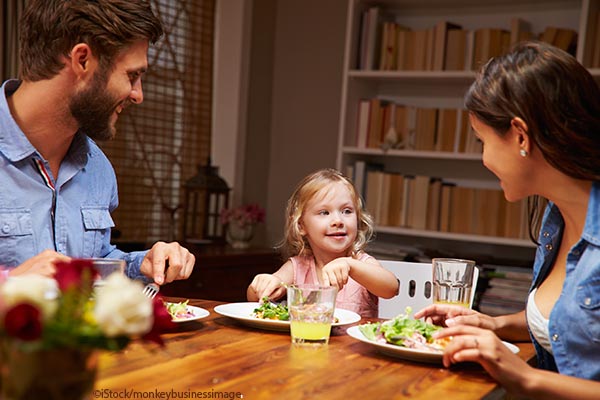 family talking at dinner