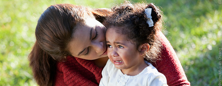 Mother comforting daughter