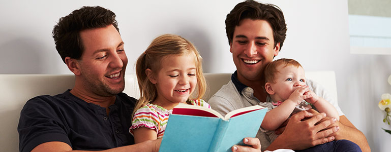 family in bed reading