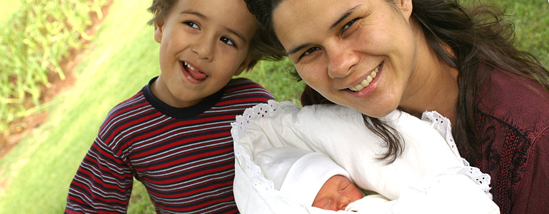 mom with newborn and toddler