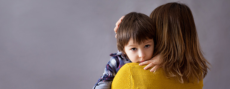 mother hugging son