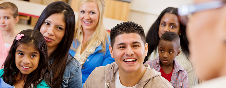 Parents and kids at school meeting