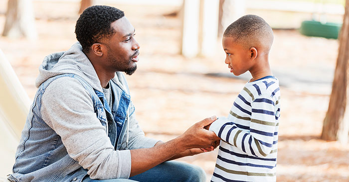 father talking to son