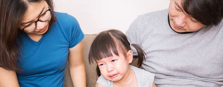 parents comforting child