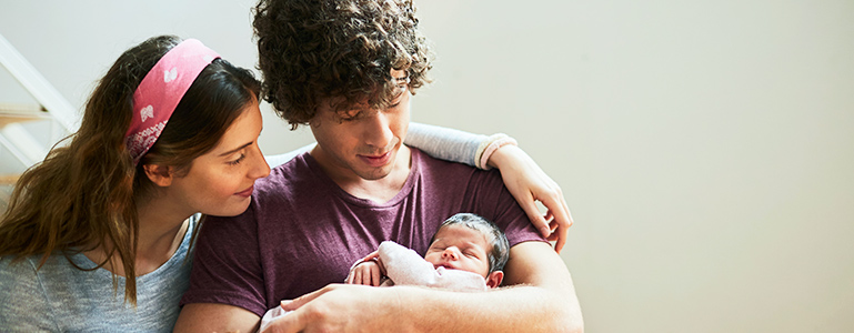 young couple with new baby