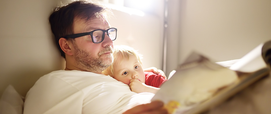 father and child in bed