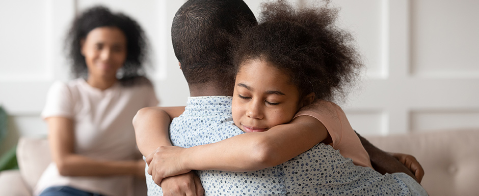 daughter hugging father