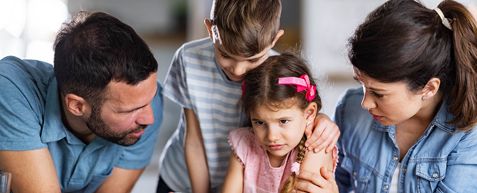 family comforting child