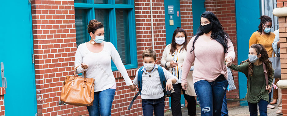 group of students and parents leaving school